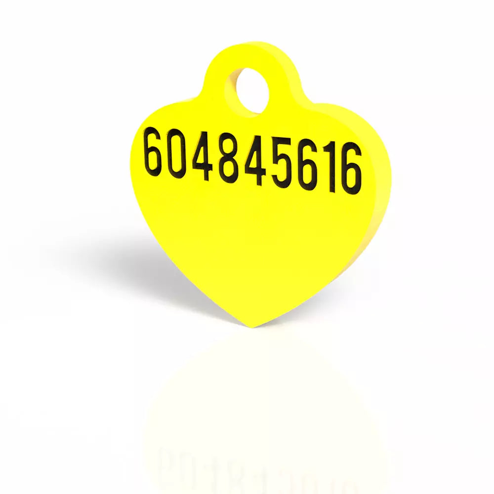 Número de contacto grabado en la parte trasera de la chapita corazón, color amarillo